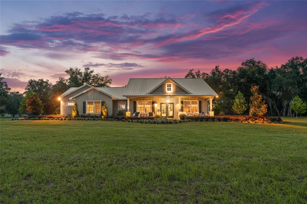 21679 Southwest 106th Lane Road Dunnellon, FL 34431 - Photo 87 of 88 a front view of a house with a yard