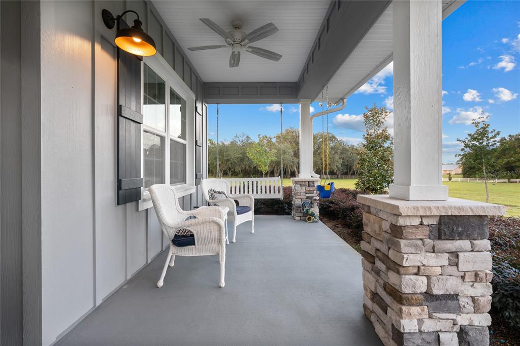 21679 Southwest 106th Lane Road Dunnellon, FL 34431 - Photo 9 of 88 a view of a patio with couches and table and chairs and potted plants