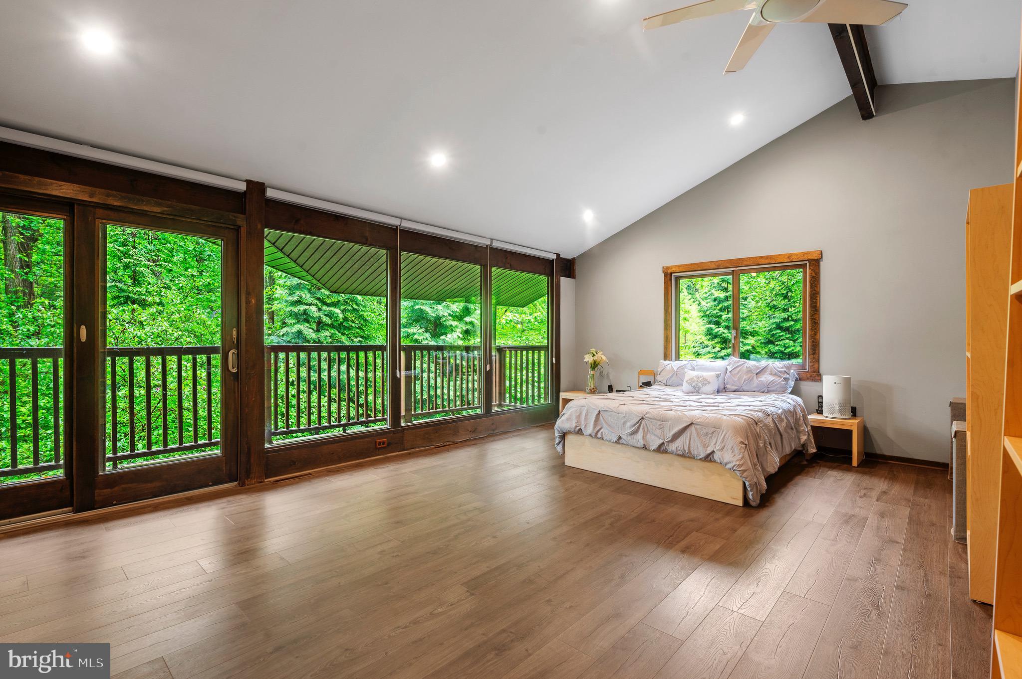 813 Old State Road Berwyn, PA 19312 - Photo 21 of 64 a spacious bedroom with a large bed and a large window