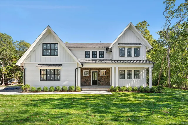 front view of a house with a yard