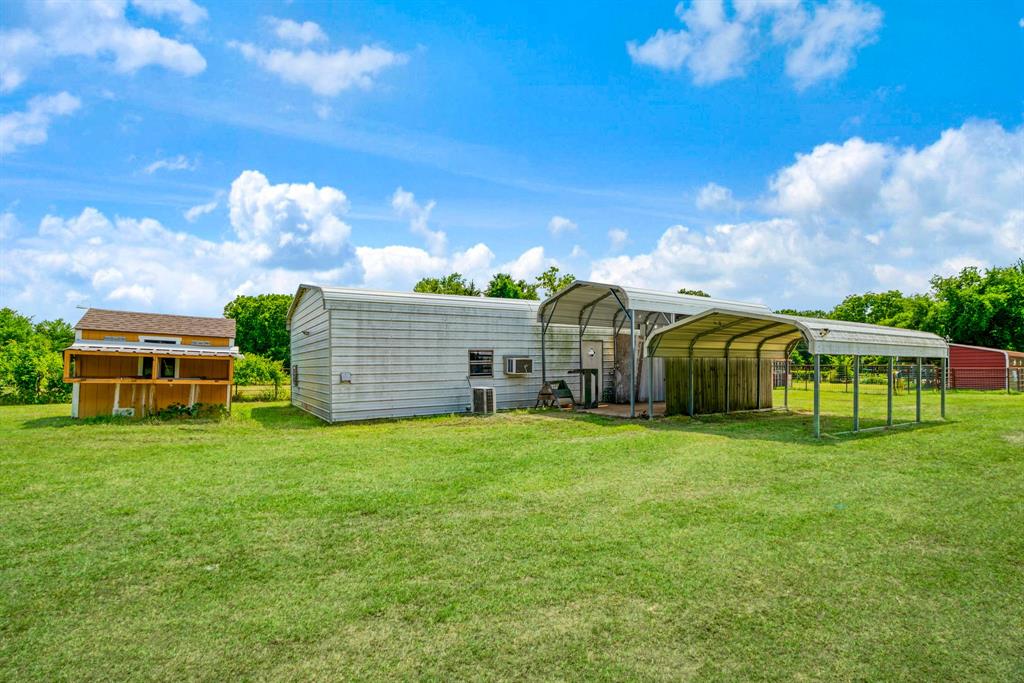 735 1st Southwest Detroit, TX 75436 - Photo 22 of 26 a front view of a house with garden