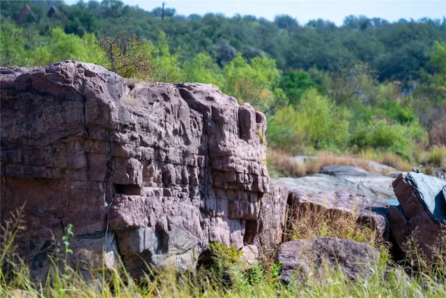 a view of a wooden house with a yard