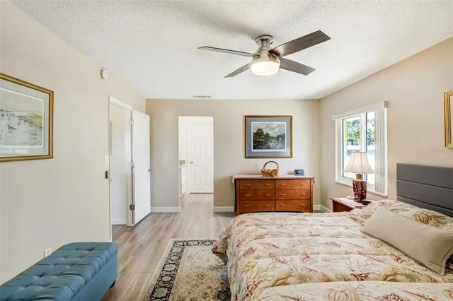 a bedroom with a large bed and a dresser