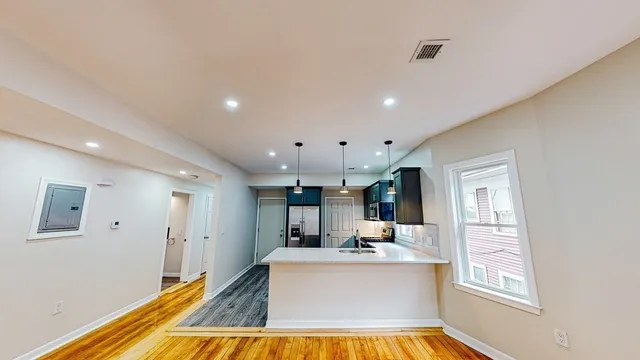 a view of kitchen with microwave and furniture