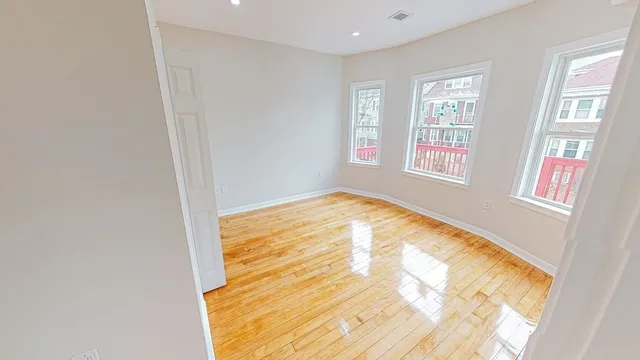 a view of an empty room with a window