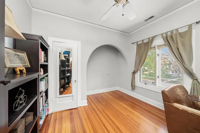 a view of a livingroom with furniture and staircase