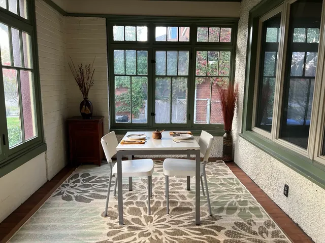 a table and chairs in a balcony