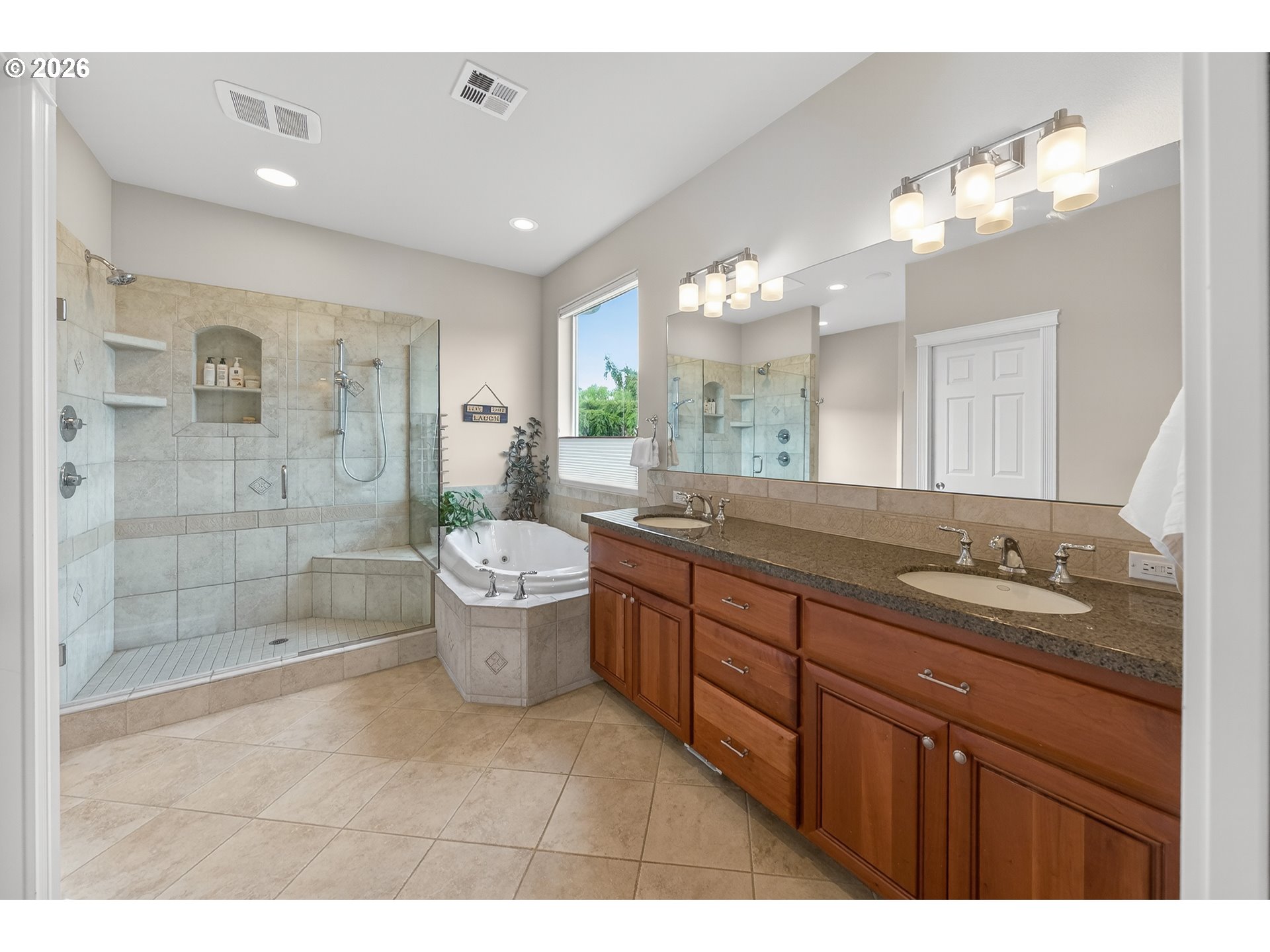2700 Melrose Road Roseburg, OR 97471 - Photo 17 of 48 a bathroom with a granite countertop sink a toilet a mirror and shower