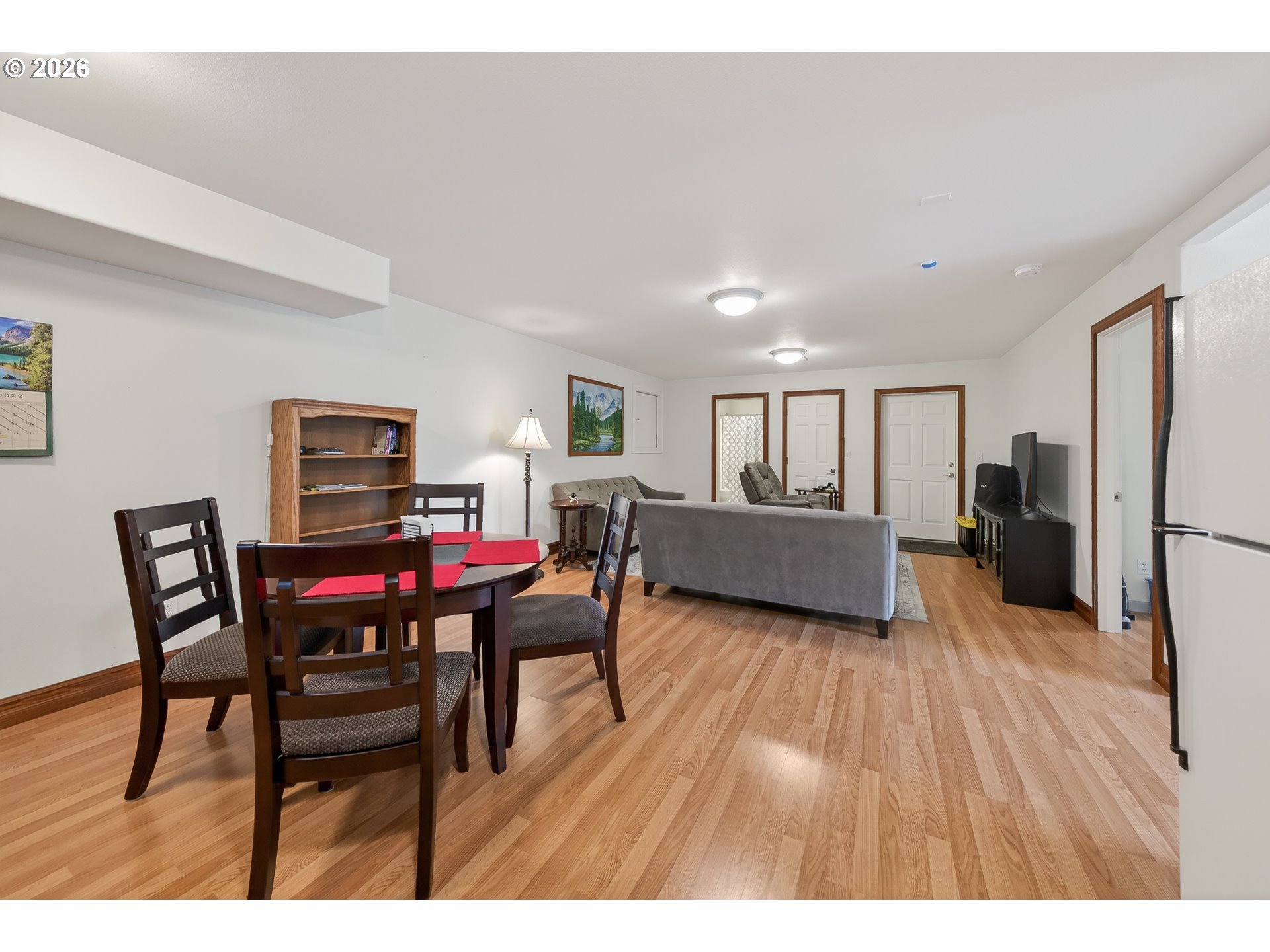 2700 Melrose Road Roseburg, OR 97471 - Photo 35 of 48 a living room with furniture wooden floor and a kitchen view