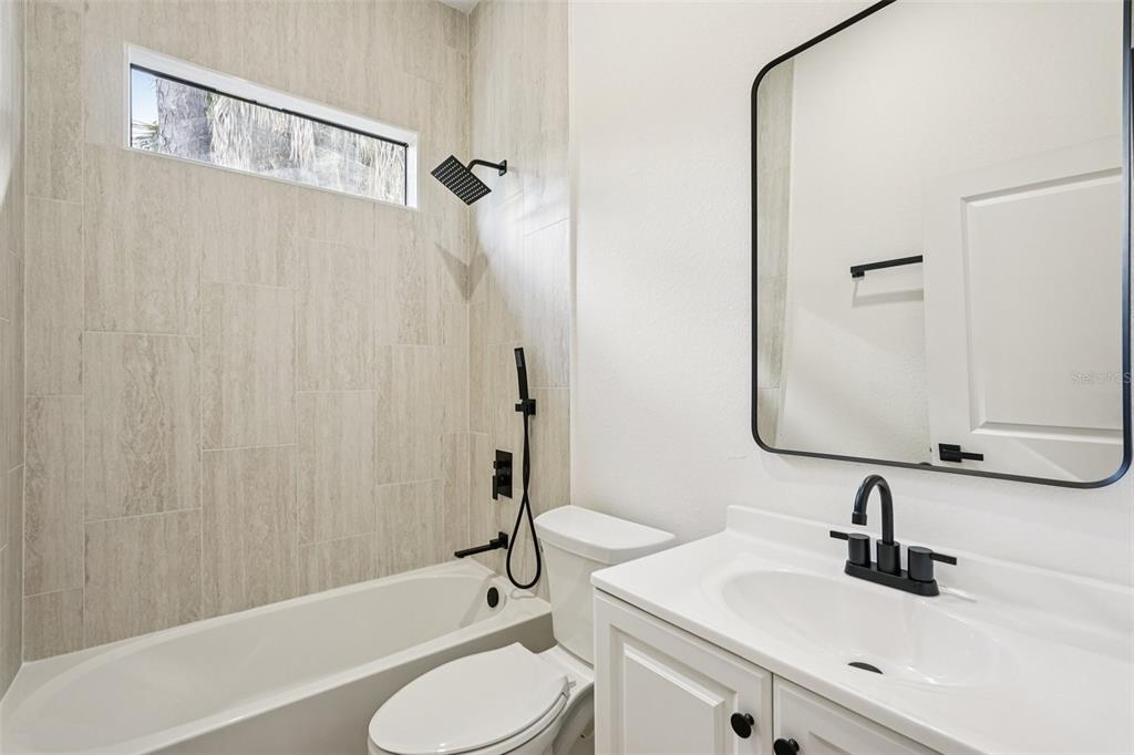 1852 Rada Lane North Port, FL 34288 - Photo 18 of 29 a bathroom with a sink toilet and shower