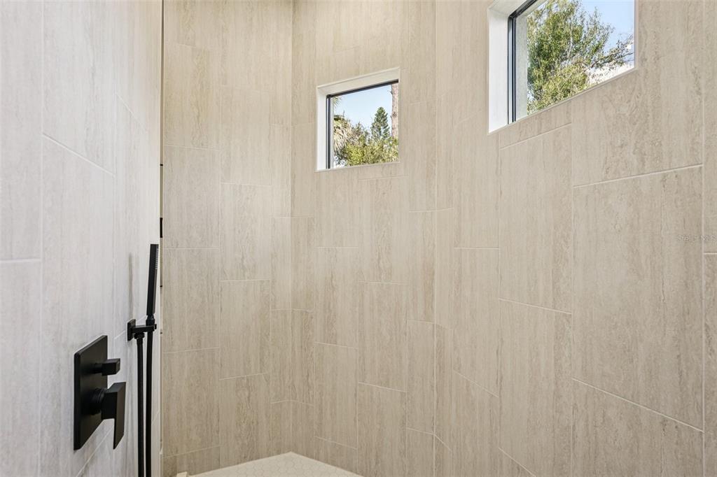 1852 Rada Lane North Port, FL 34288 - Photo 19 of 29 a bathroom with a shower curtain and a window