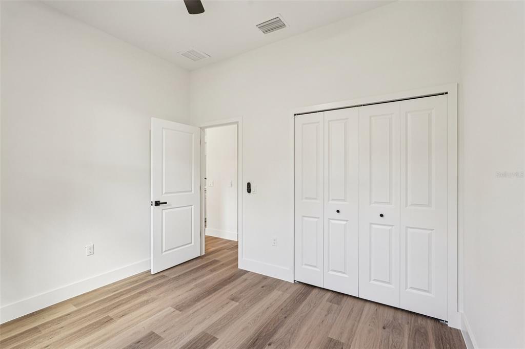 1852 Rada Lane North Port, FL 34288 - Photo 22 of 29 a view of an empty room with wooden floor