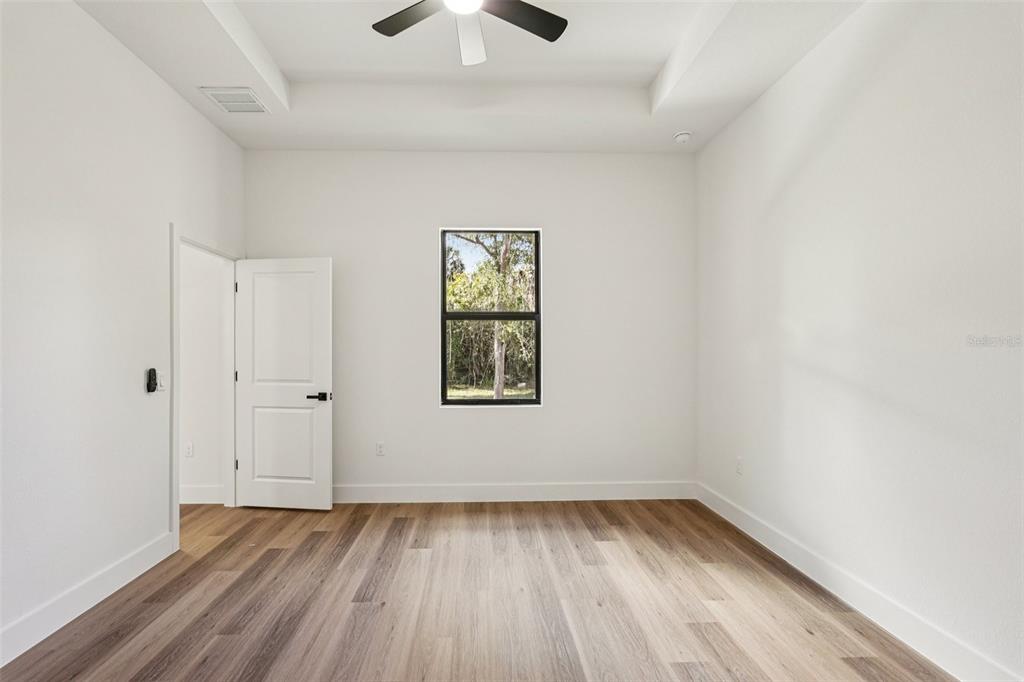 1852 Rada Lane North Port, FL 34288 - Photo 24 of 29 wooden floor in an empty room with a window