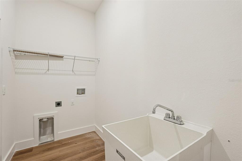 1852 Rada Lane North Port, FL 34288 - Photo 26 of 29 a bathroom with a sink and cabinets