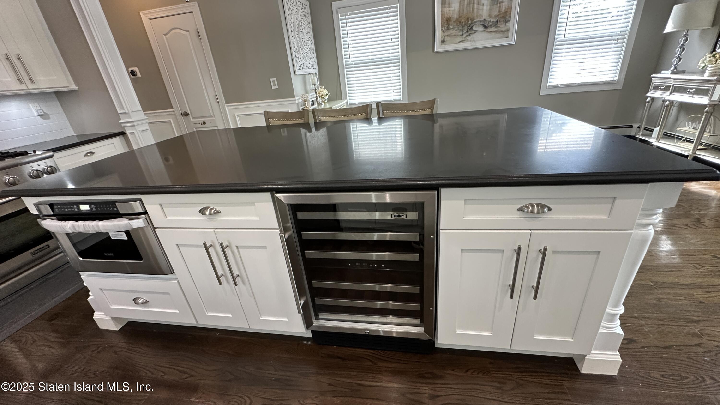 998 Annadale Road Staten Island, NY 10312 - Photo 15 of 46 a view of washer and dryer with wooden floor
