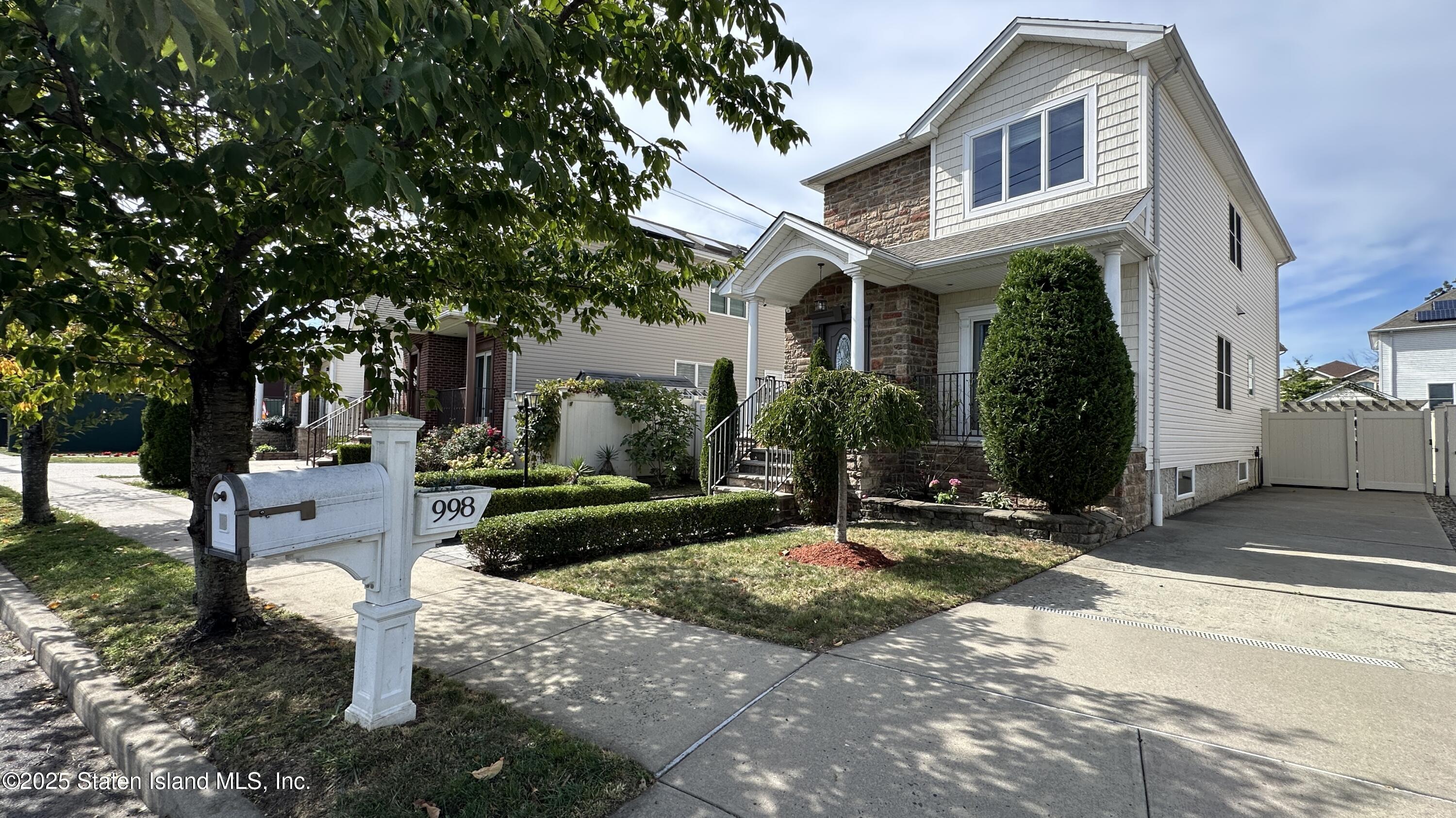 998 Annadale Road Staten Island, NY 10312 - Photo 2 of 46 a front view of a house with a garden