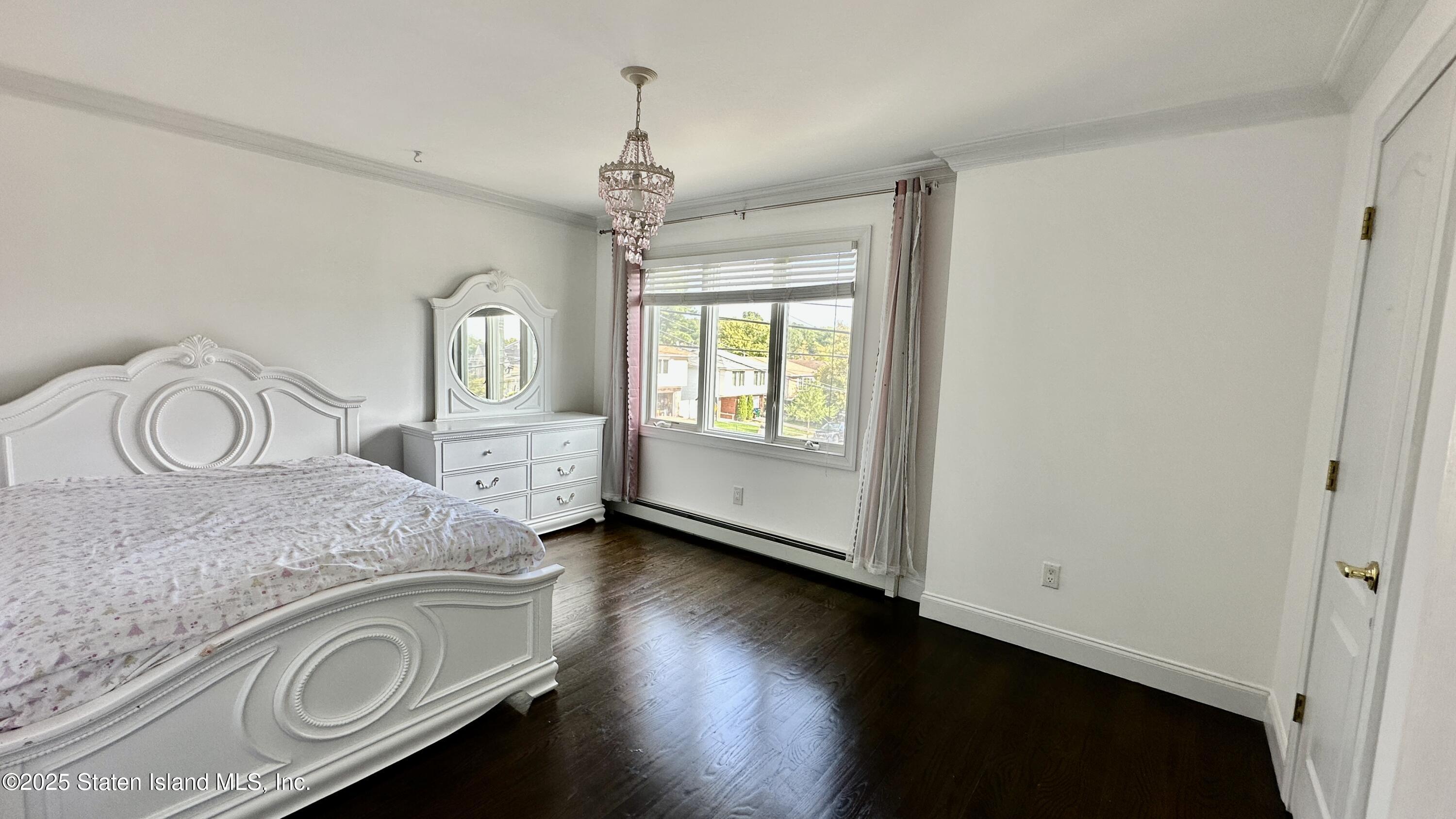 998 Annadale Road Staten Island, NY 10312 - Photo 23 of 46 a spacious bathroom with a granite countertop sink and a mirror