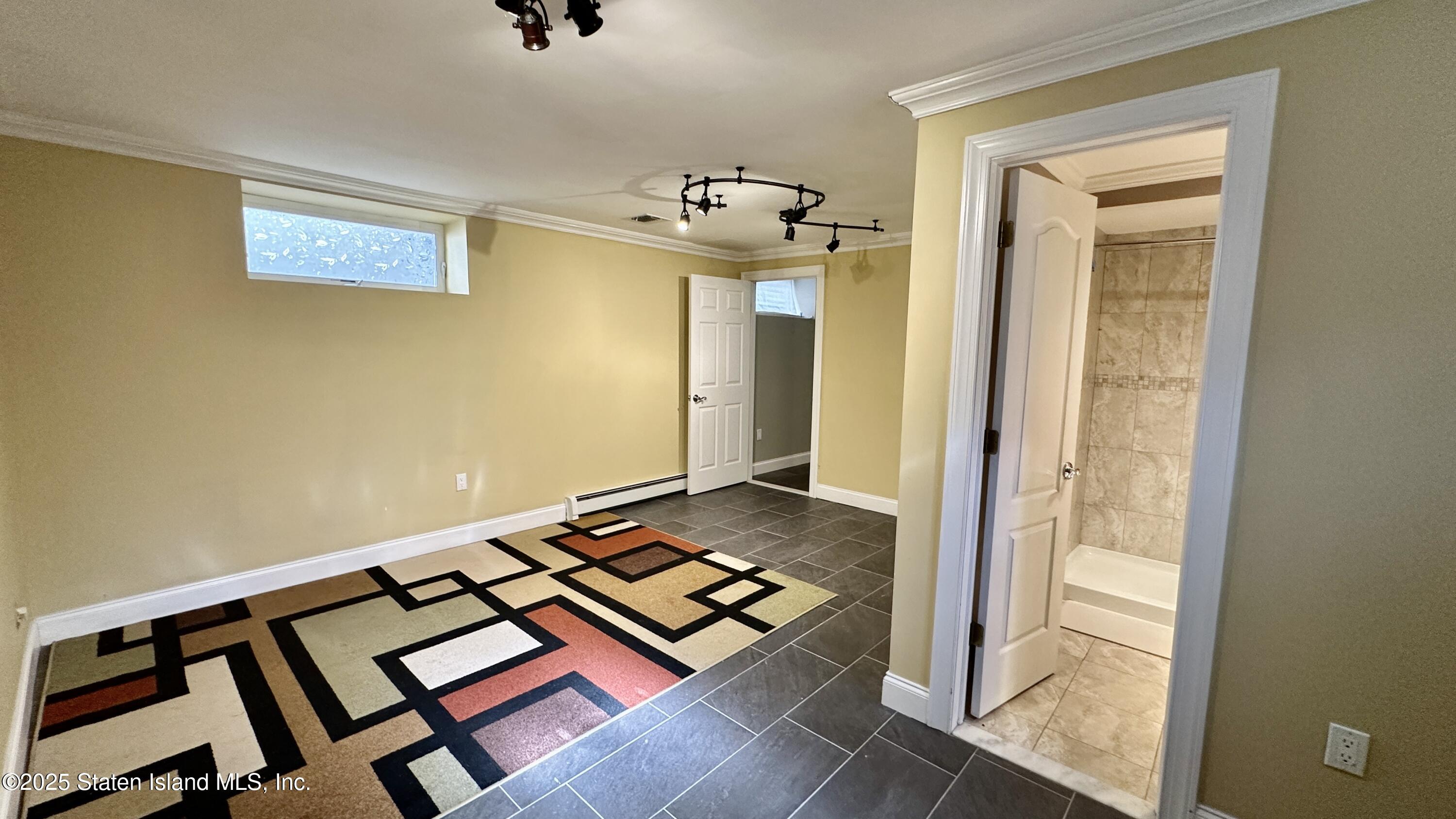 998 Annadale Road Staten Island, NY 10312 - Photo 32 of 46 a view of an empty room and window