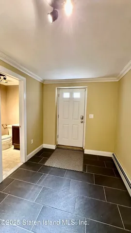 an empty room with a empty space and windows