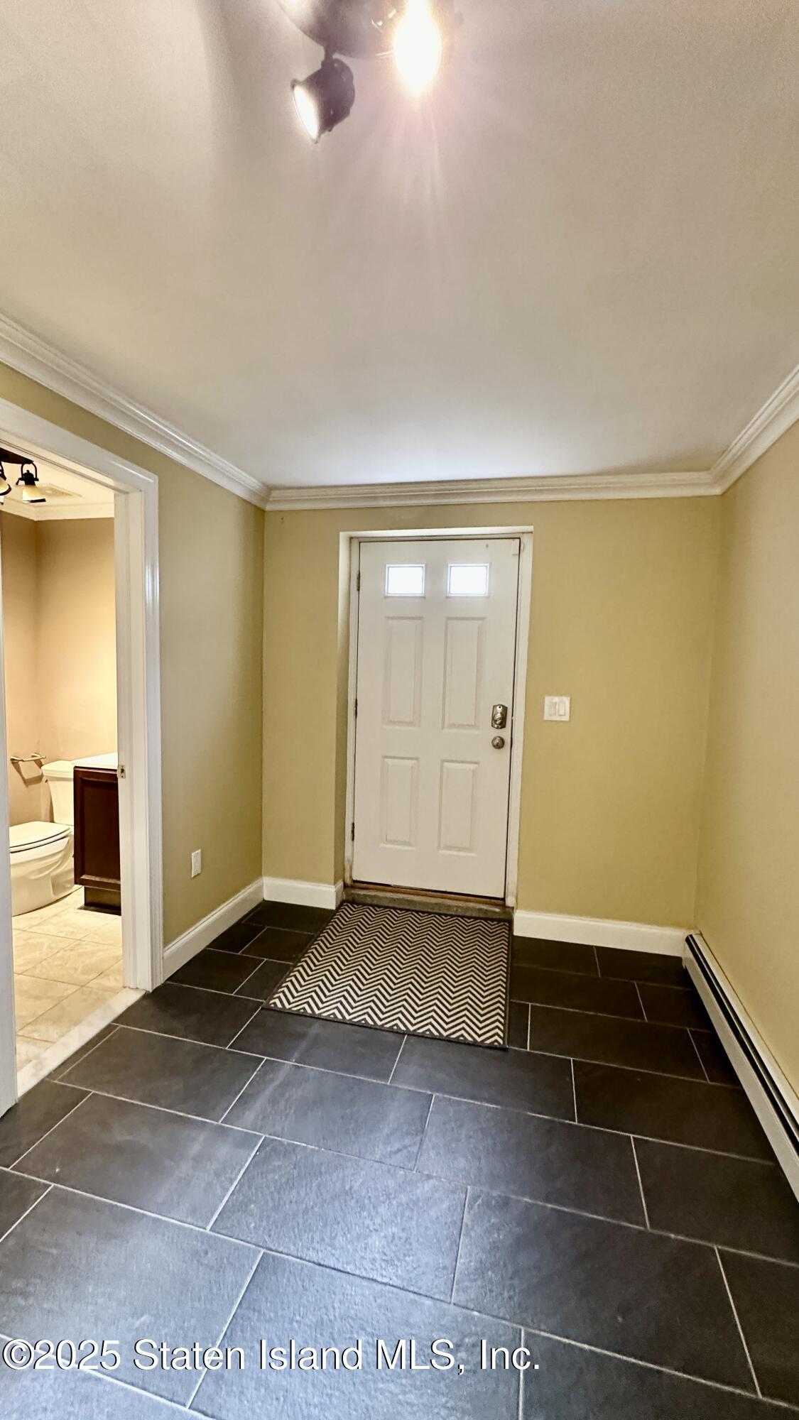 998 Annadale Road Staten Island, NY 10312 - Photo 34 of 46 an empty room with a empty space and windows