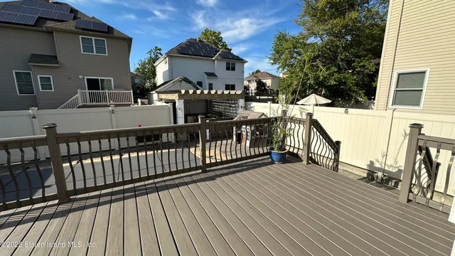 a view of a house with wooden deck