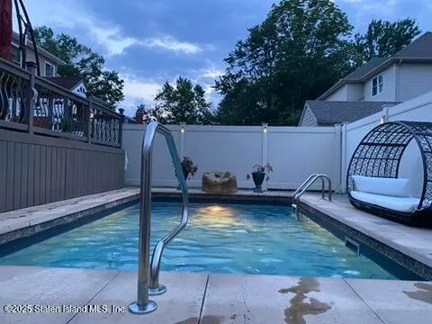 a view of a backyard with a sitting area