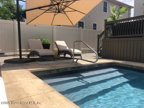 998 Annadale Road Staten Island, NY 10312 - Photo 44 of 46 a view of backyard with wheel chair and wooden fence
