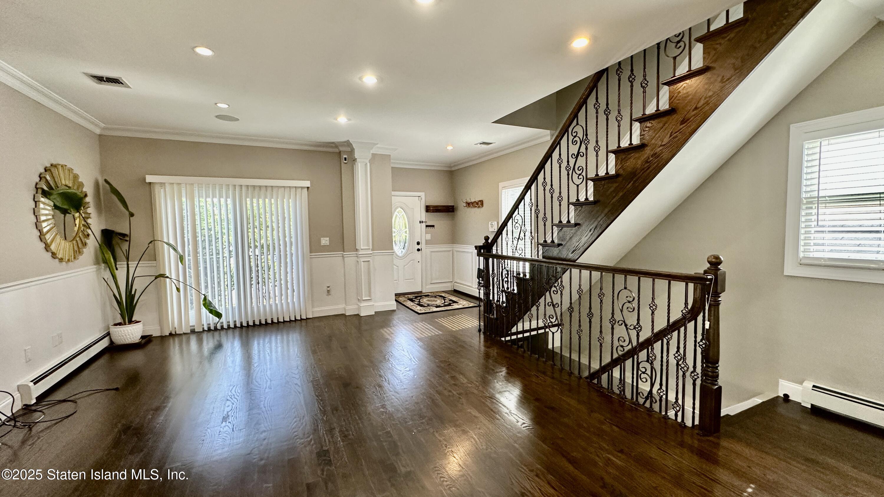 998 Annadale Road Staten Island, NY 10312 - Photo 6 of 46 a view of entryway with wooden floor and stairs