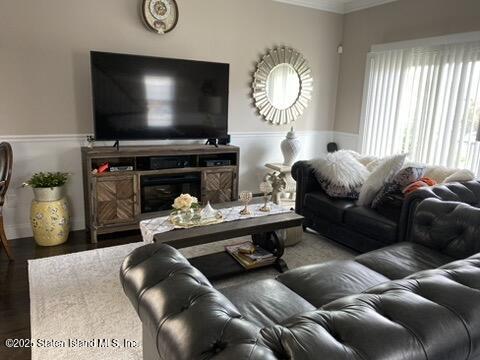 998 Annadale Road Staten Island, NY 10312 - Photo 8 of 46 a living room with furniture and a flat screen tv