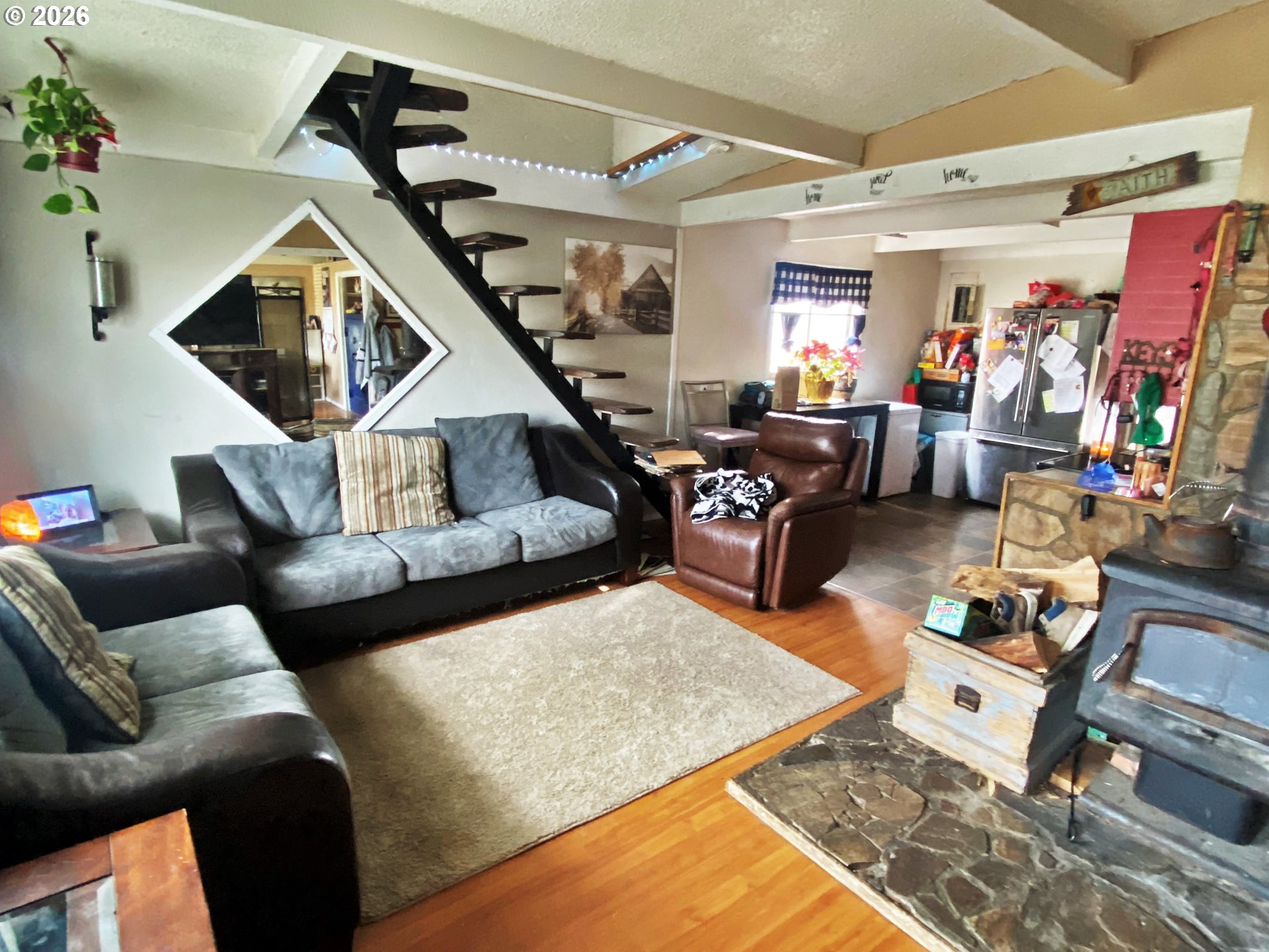 1609 Baker Street Baker City, OR 97814 - Photo 2 of 7 a living room with furniture and a ceiling fan