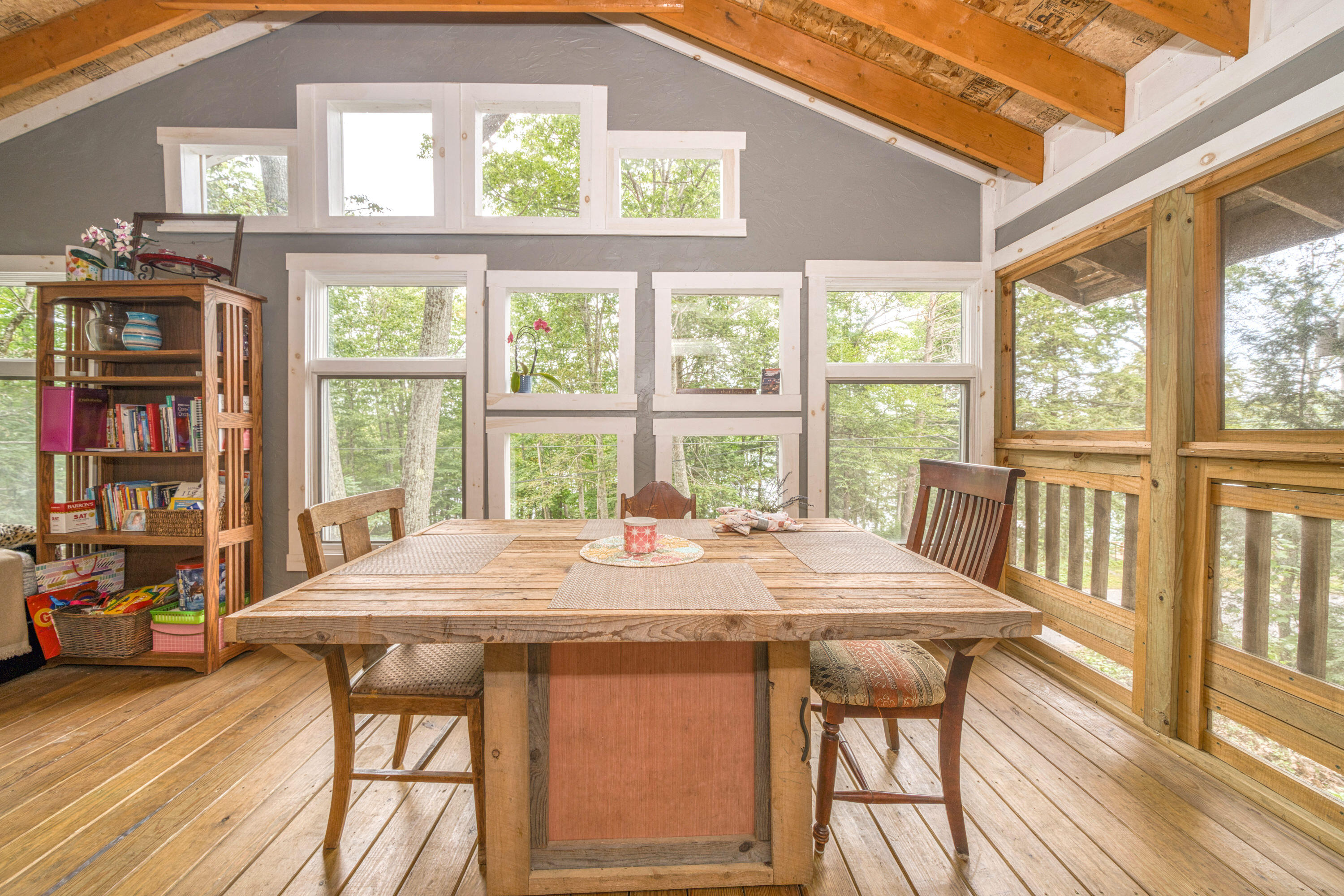 999 Brewer Lake Road Orrington, ME 04474 - Photo 26 of 36 Screened porch dining area