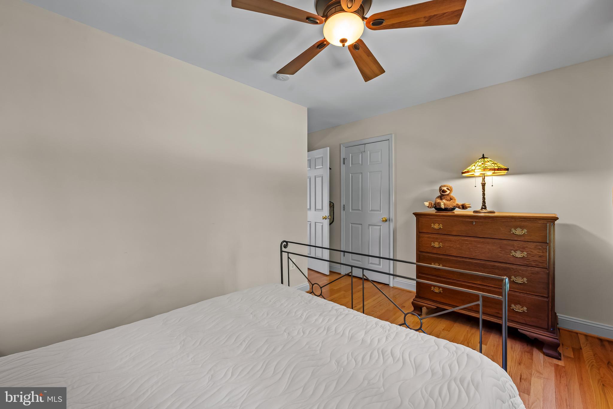 5026 Mt Carmel Road Hampstead, MD 21074 - Photo 31 of 57 a bedroom with a bed and a chandelier