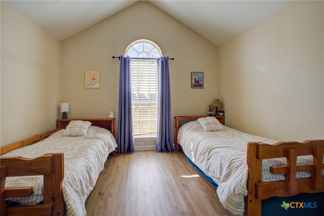 940 Cordova Loop Seguin, TX 78155 - Photo 13 of 32 a bedroom with a bed and a window