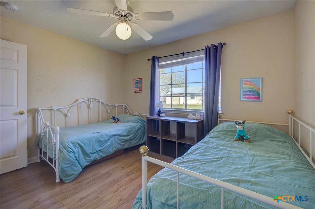 940 Cordova Loop Seguin, TX 78155 - Photo 15 of 32 a bedroom with a bed and a window