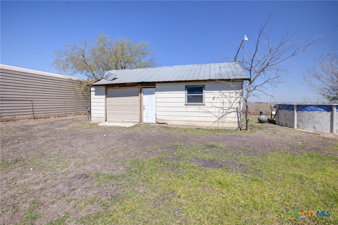 940 Cordova Loop Seguin, TX 78155 - Photo 21 of 32 a view of a house with backyard and garage