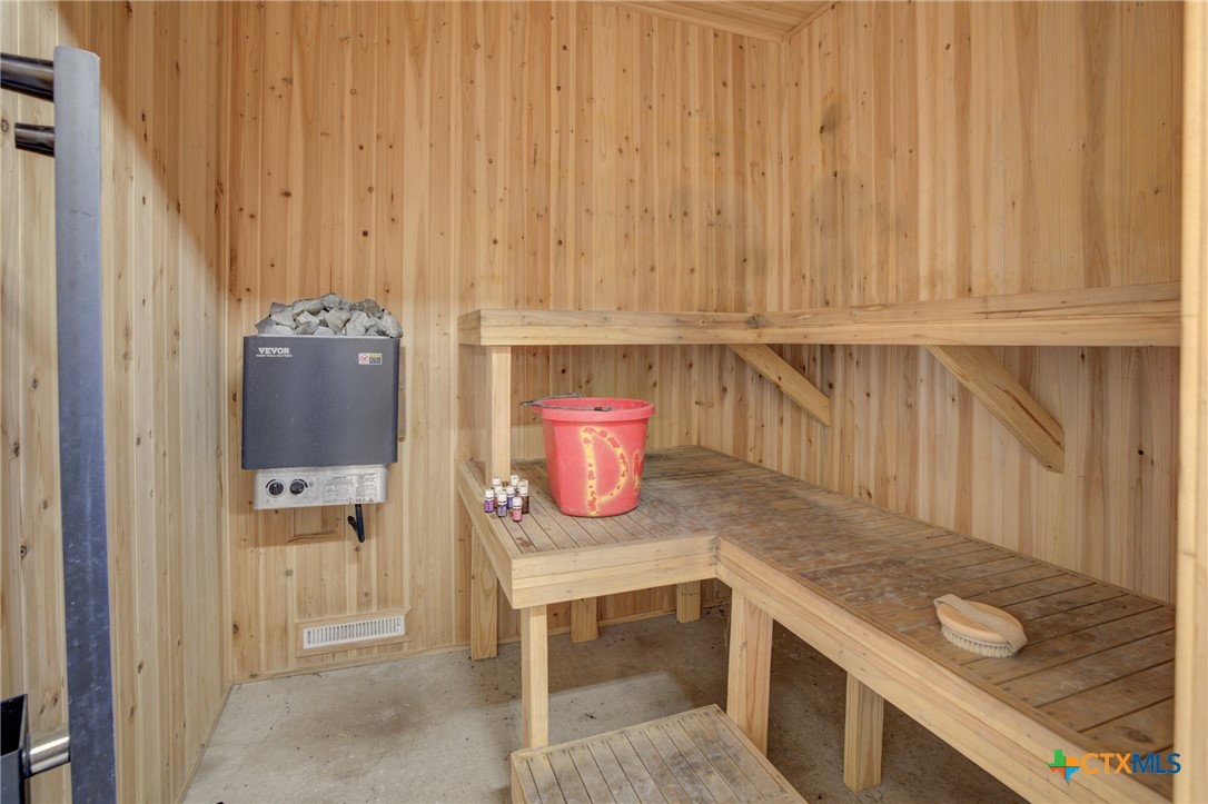 940 Cordova Loop Seguin, TX 78155 - Photo 25 of 32 a kitchen with stainless steel appliances granite countertop a refrigerator and a sink