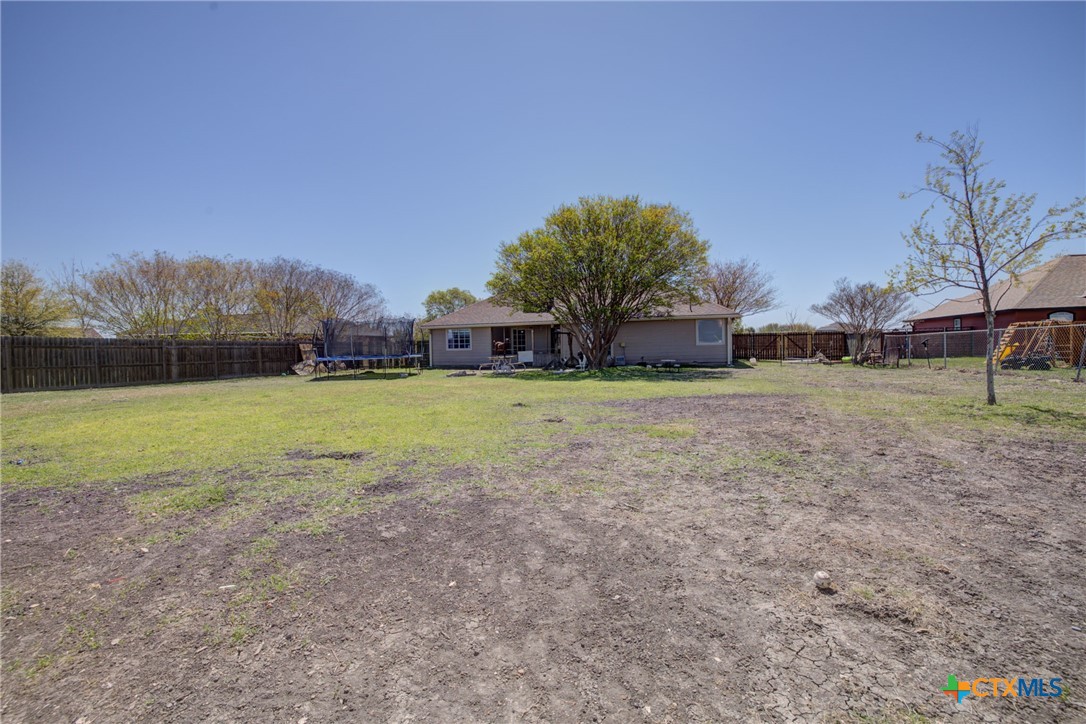 940 Cordova Loop Seguin, TX 78155 - Photo 27 of 32 a view of a green field with trees in the background