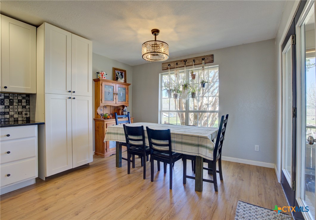 940 Cordova Loop Seguin, TX 78155 - Photo 6 of 32 a view of a dining room with furniture window and wooden floor