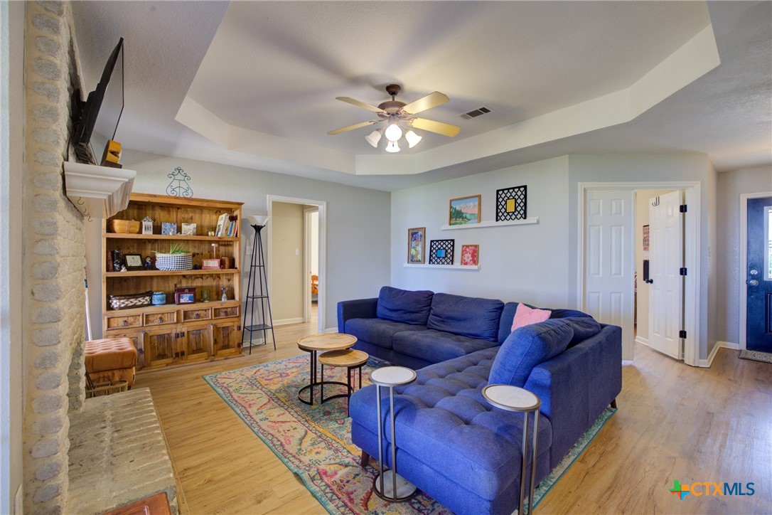 940 Cordova Loop Seguin, TX 78155 - Photo 8 of 32 a living room with furniture a ceiling fan and a rug
