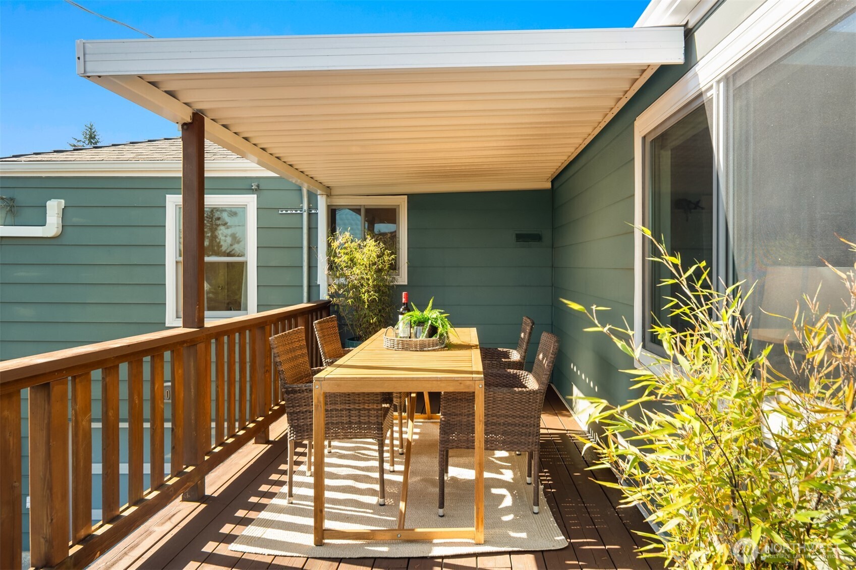 4026 52nd Avenue Southwest Seattle, WA 98116 - Photo 15 of 37 a balcony with table and chairs