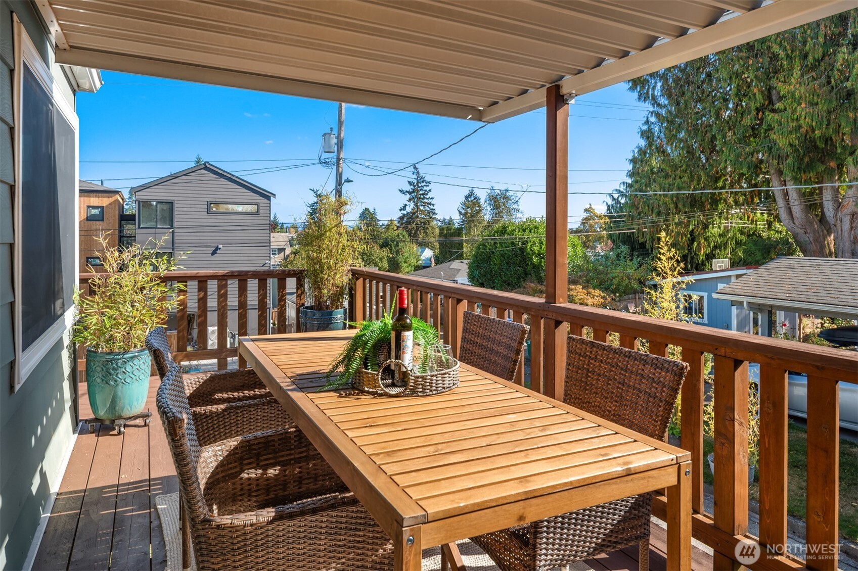 4026 52nd Avenue Southwest Seattle, WA 98116 - Photo 16 of 37 a view of a balcony with wooden floor and outdoor seating