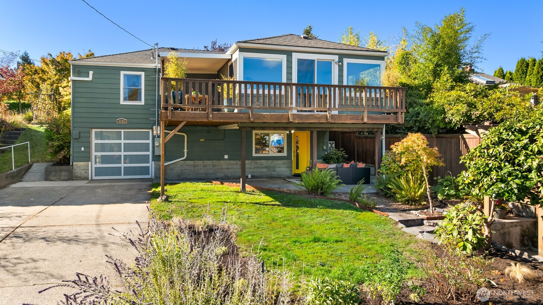 4026 52nd Avenue Southwest Seattle, WA 98116 - Photo 33 of 37 a front view of a house with a yard
