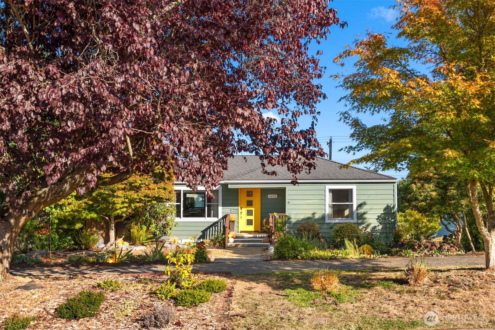 4026 52nd Avenue Southwest Seattle, WA 98116 - Photo 36 of 37 a front view of a house with a yard