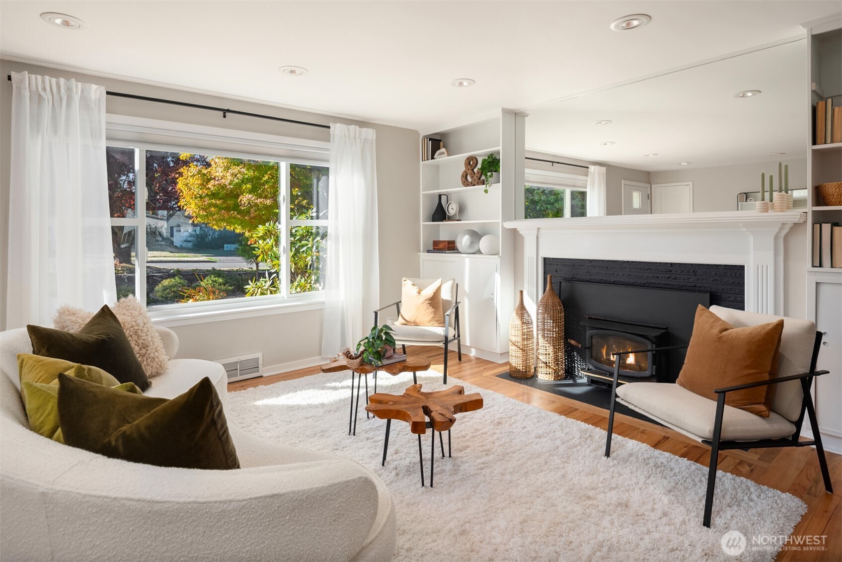 4026 52nd Avenue Southwest Seattle, WA 98116 - Photo 5 of 37 a living room with furniture and a fireplace