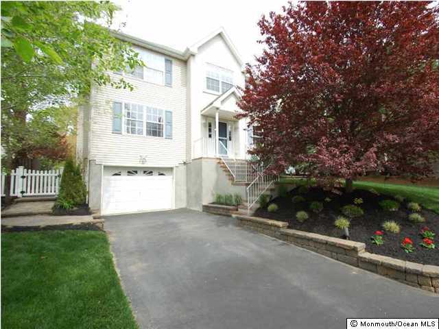 401 Old Bridge Road Brielle, NJ 08730 - Photo 2 of 3 a view of a house with a yard and a garage