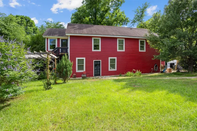 a view of a house with a porch and furniture