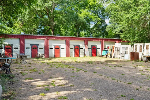 a kitchen with a table chairs stove and cabinets
