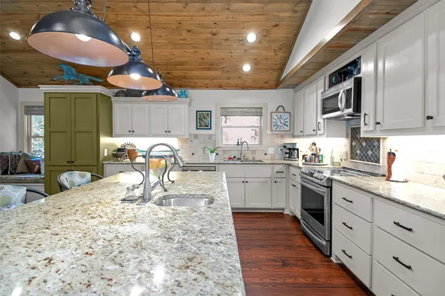 a room with furniture or kitchen view and a wooden floor