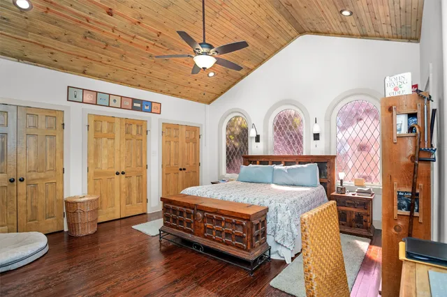 a bedroom with a bed and a television