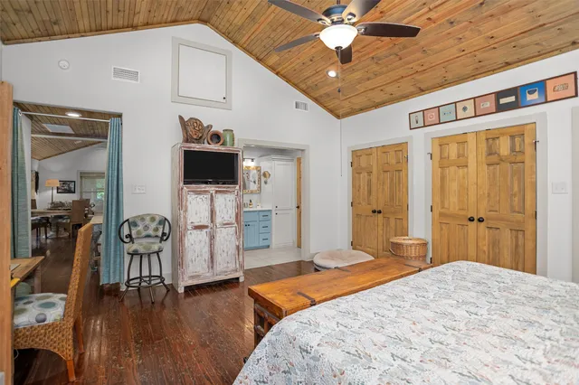 a bathroom with a shower sink and mirror